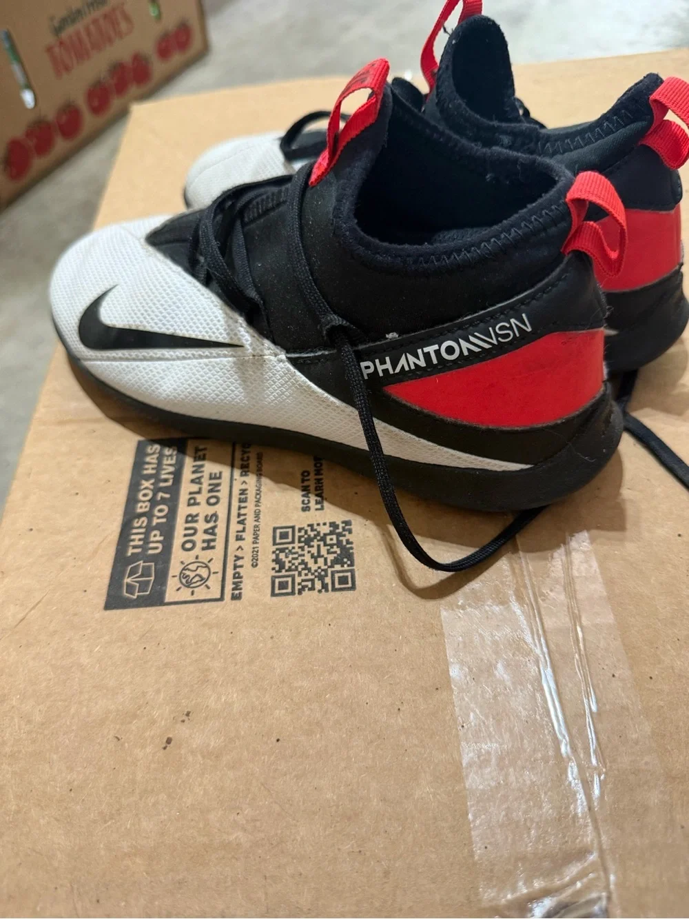 Nike Youth White and Black Athletic Trainers with Red Pull Tabs